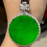 A Quality Circular Jadeite Pendant with Zirconia Surround and Cord