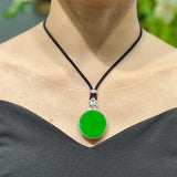 A Quality Circular Jadeite Pendant with Zirconia Surround and Cord